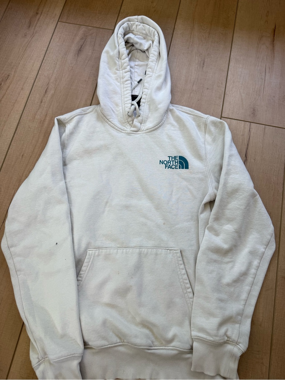 The North Face Cream Hoodie with Teal Logo